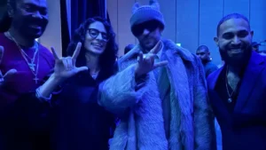 Bad Bunny during the 2026 Super Bowl Half Time show In Levi Stadium photographed with Deaf Puerto Rican sign language interpreter hired by the NFL, Celimar Rivera Cosme